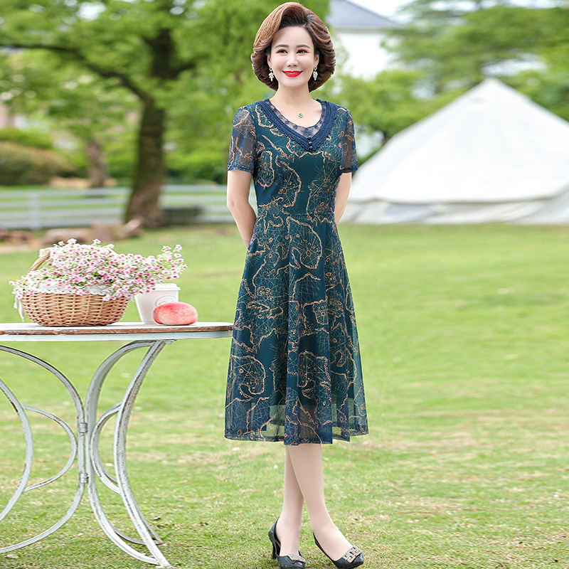 中年のお母さんの婦人服の半袖のワンピースの夏服の洋風の百塔の気質の大きいサイズの新型はやせている中高年のスカートを現します。|undefined