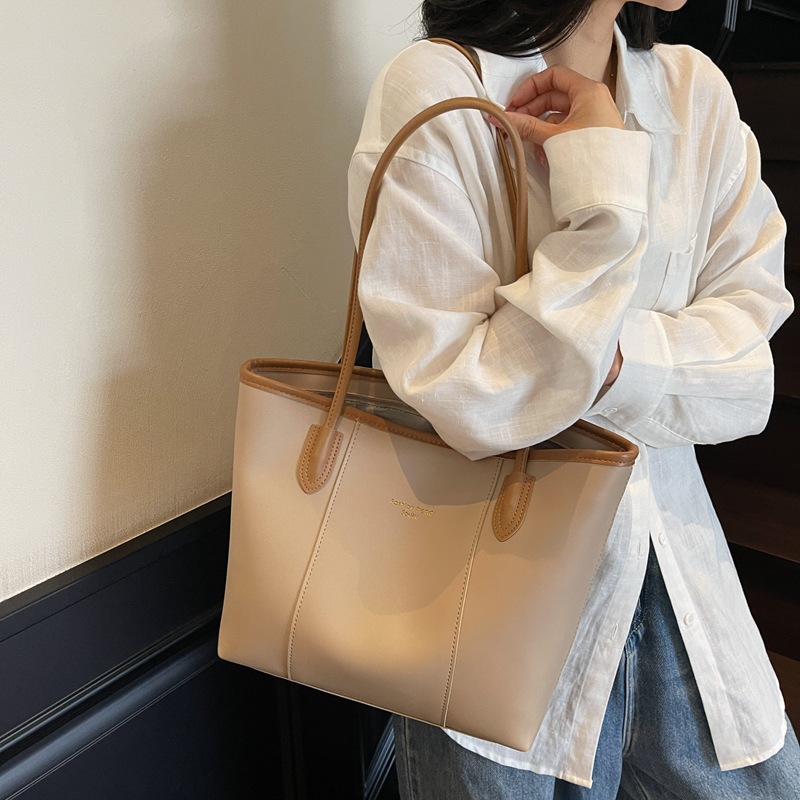 Bolso Tote nuevo producto más vendido transfronterizo para mujer de gran capacidad 2025 todo-fósforo casual simple de alta calidad bolsa de axila de un solo hombro