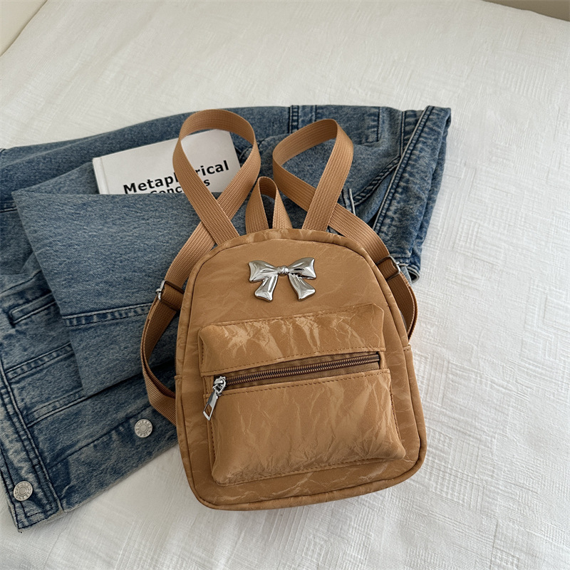 Mochila de arco para mujeres, estilo de estilo casual, moda coreana, mochila de balde, mochila de viaje pequeña y ligera