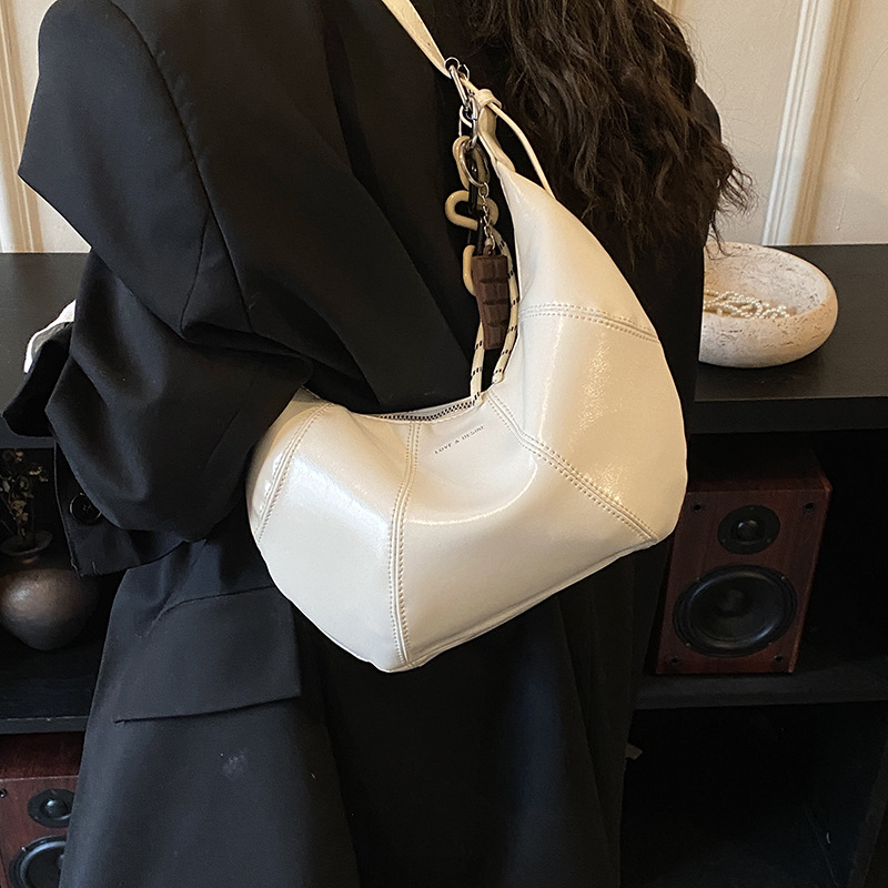 Transfronterizos coreanos perezosos bolsas de brazo de cera nicho bolsas de cuerno de piel de cera 2026 nuevas bolsas de brazo diarias mujeres