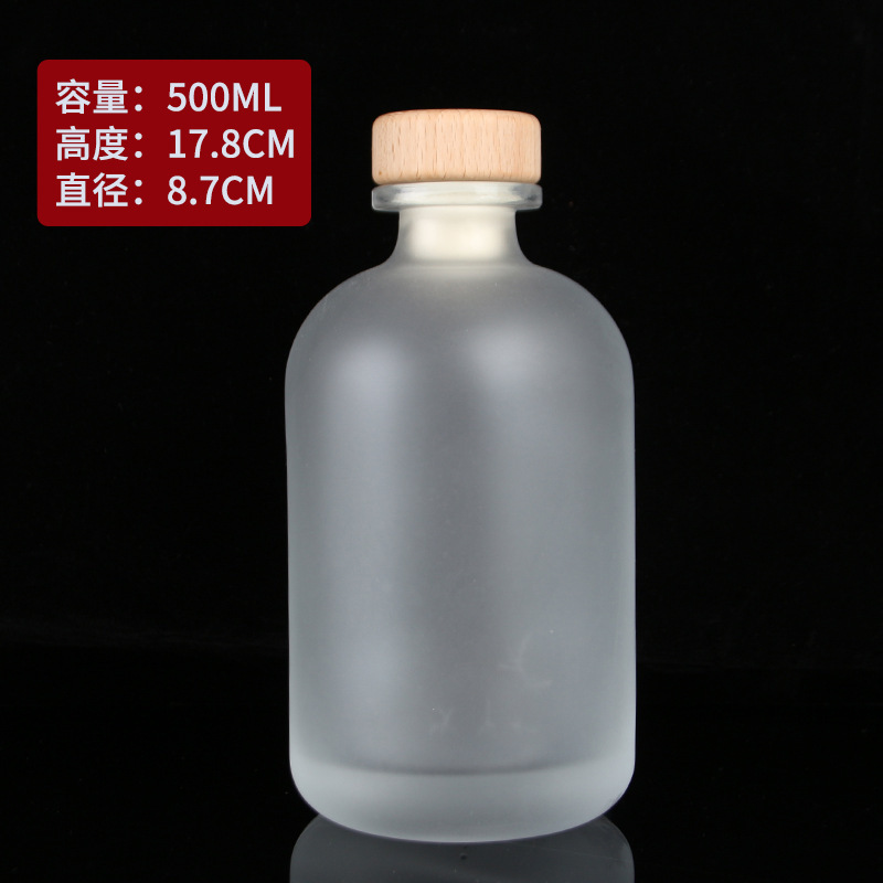 Botella de vidrio esmerilado transparente al por mayor botella de vino de fruta casera de cerveza botella de vino vacía botella de vodka botella de vino de ciruela cubierta de madera