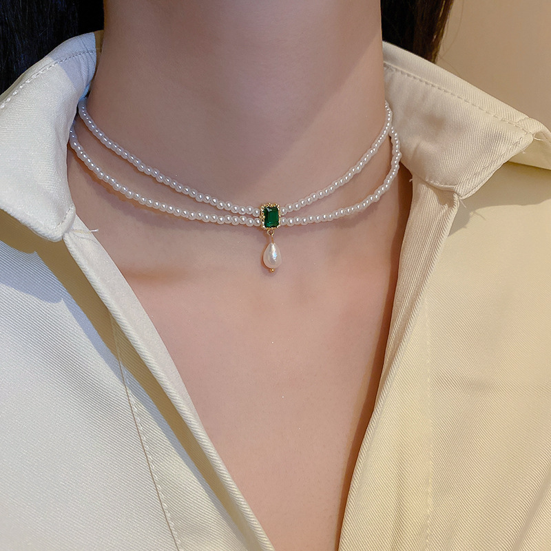 Collar de perlas con lazo de flor con cuentas francesas Elegante cadena de clavícula con sentido de alta gama retro ligero decoración de lujo femenino