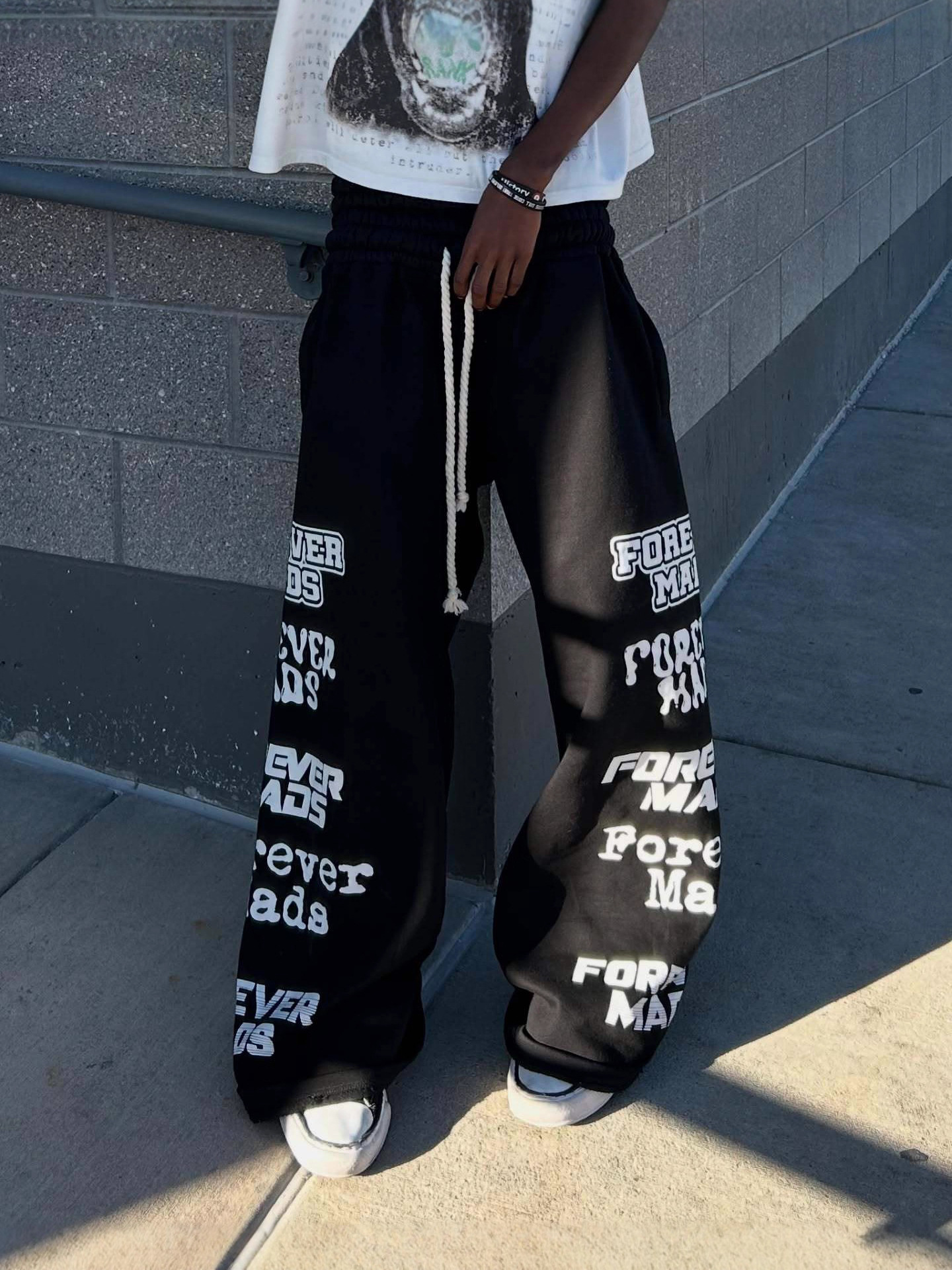Otoño y invierno nuevos pantalones europeos y estadounidenses de diseño de doble extremo estampado personalidad callejera de piernas largas pantalones casuales para hombres y mujeres image 5
