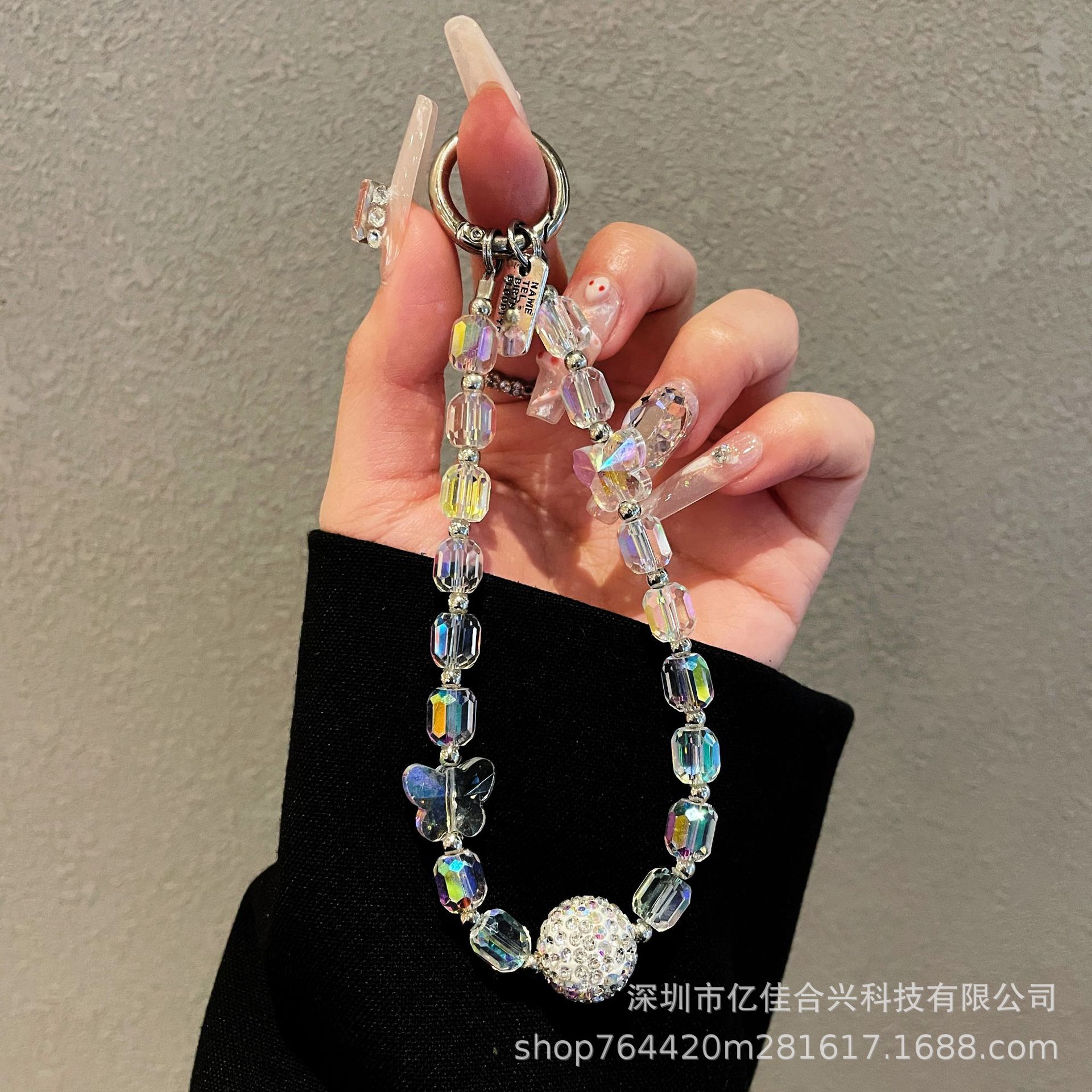 Japón y Corea del Sur estilo transfronterizo nuevo caso de teléfono móvil colgante cadena de cristal string arco de diamante cadena de teléfono móvil colgante de muñeca