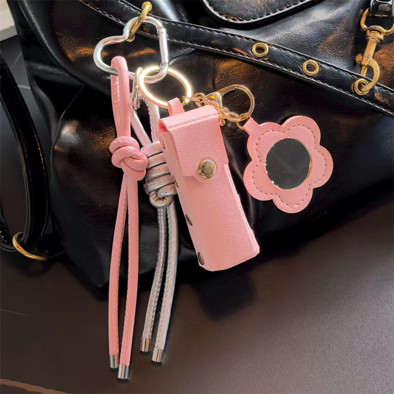 Espejo de cuero transfronterizo lápiz labial bolsas de llaves creativas flores portátiles maquillaje espejo bolsas colgantes accesorios de llaves PU