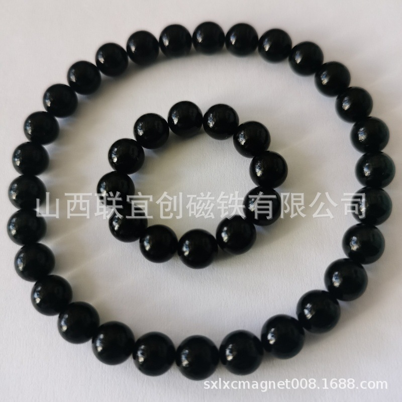 厂家供应7mm亮光黑色艾灸石稀土无绳项链   磁灸石项链 磁石手链