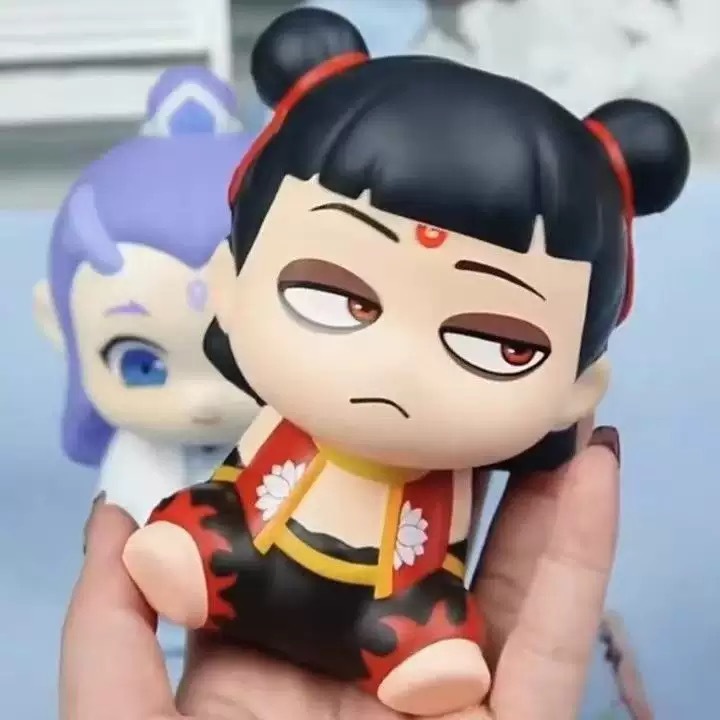 El niño demonio de Nezha, el mar genuino Q, jugar a descomprimir, pellizcar, pellizcar, película conmemorativa, adornos lindos alrededor de la manga.