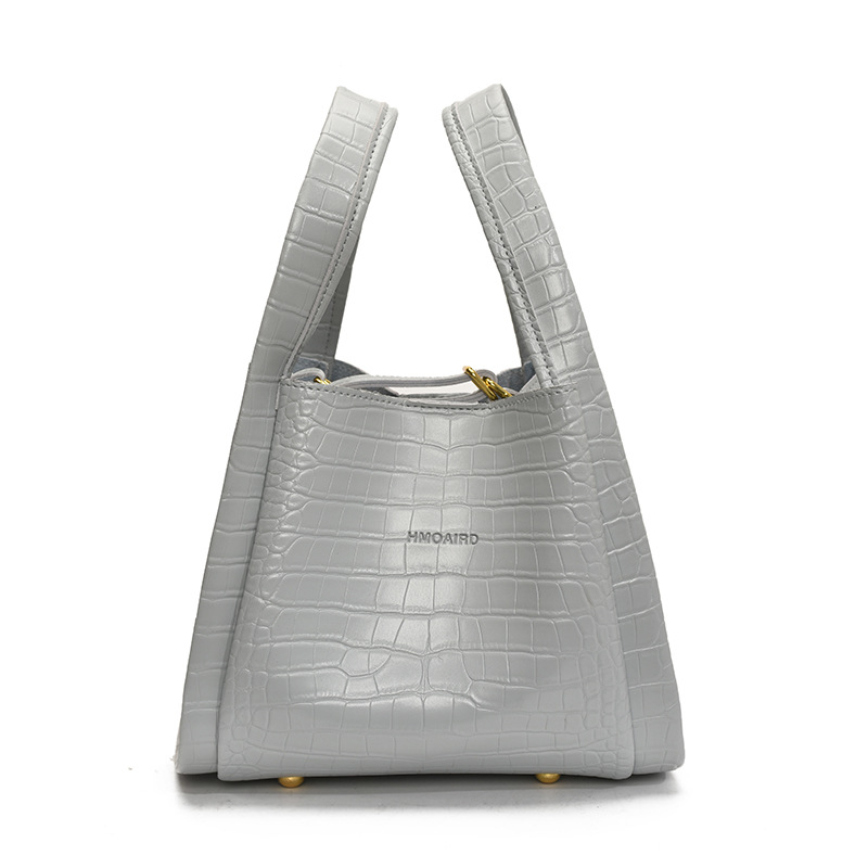 Bolso de cubo de mano de estilo explosivo con patrón de cocodrilo transfronterizo para mujer 2025 nuevo bolso de hombro con textura versátil bolso de mensajero súper caliente