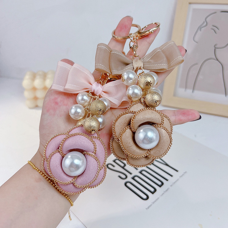 Cadena de La Perla La Camelia llavero bolsa colgante moda doble arco creativo mercancías del comercio exterior image 4