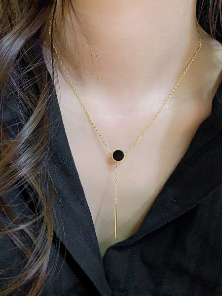 Golden necklace with tassels