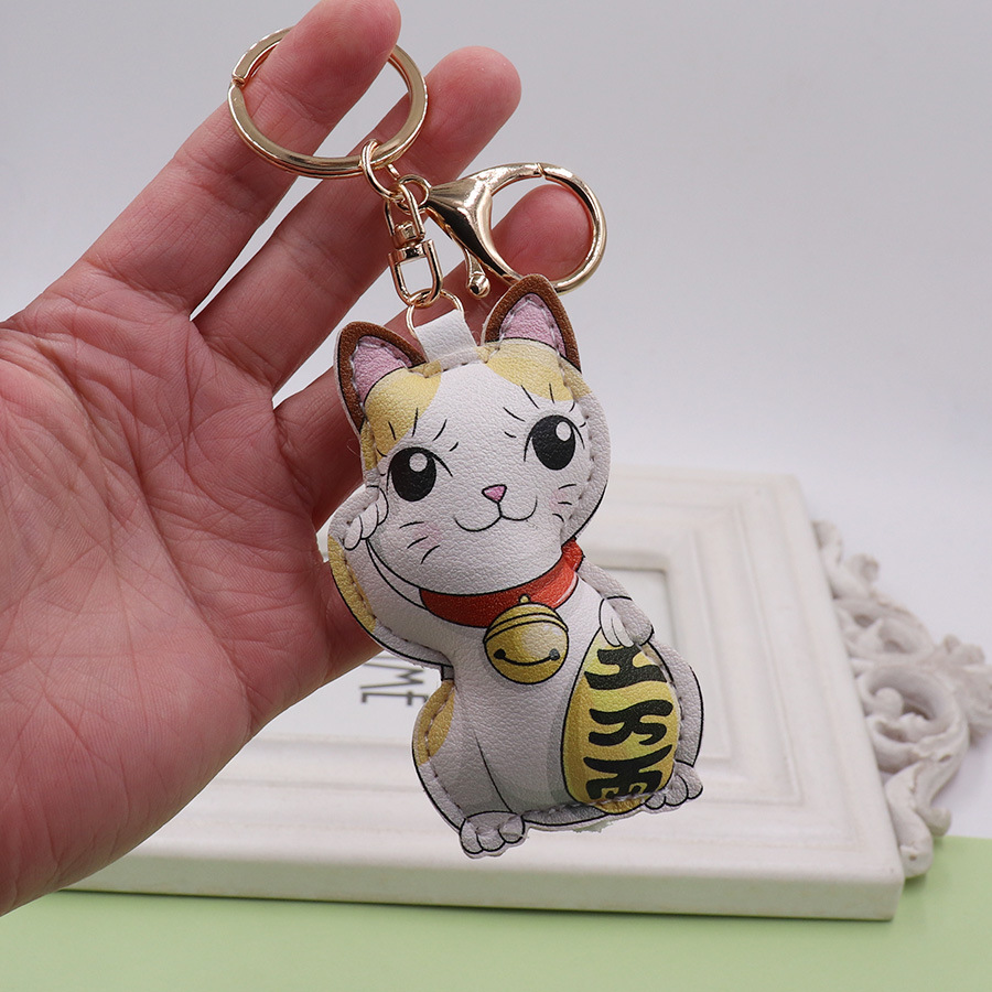 Gato afortunado llavero de cuero lindo animal la historieta del bolso colgante hombres y mujeres pareja coche pequeño regalo