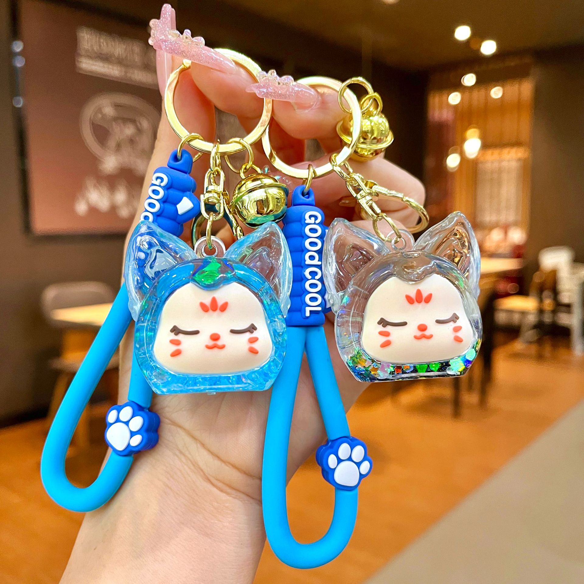 Nuevos productos acrílicos en aceite flotante botella de arena luminosa brillante nocturna KiKi zorro muñeca llavero mochila colgante bolsa al por mayor