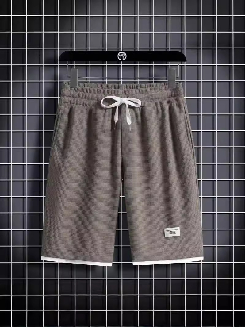 Camisa menos ropa Waffle pantalones de cinco puntos para hombres verano nuevo estilo estilo Hong Kong pantalones cortos de dos piezas falsos de color recto suelto