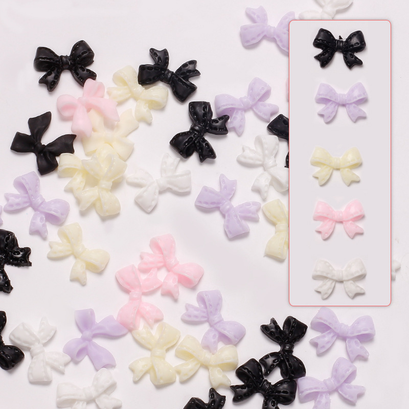 Joyas de arco de uñas al por mayor en línea explosión simple de resina joyas de uñas estereoscópicas flotantes mezcladas 50