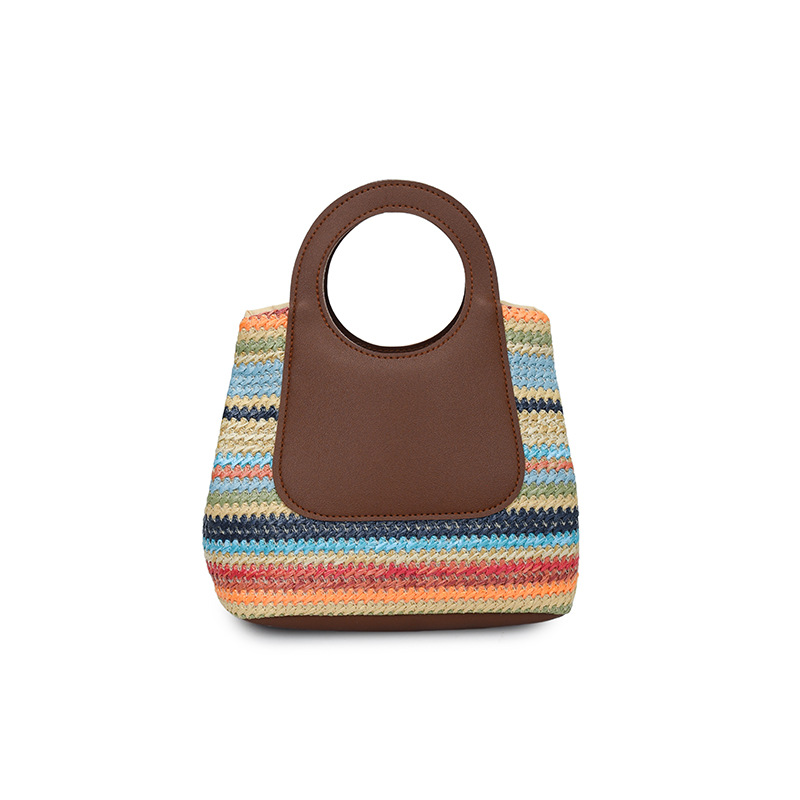 Bolsas de mano tejidas de color para mujeres 2026 nueva moda versátil nicho sensación de diseño de bolsas de viaje coreanas