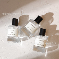卸売り50mlの厚い底の香水瓶のつや消しの黒い蓋のガラスの香水のスプレーは瓶の円柱形の空の香水の瓶を分けます。