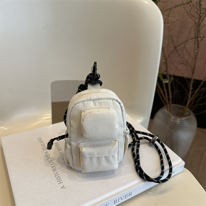 Mini colgante bolso de cambio 2025 nuevo cross-border nylon impermeable bolso de auriculares de bolsillo de hombro