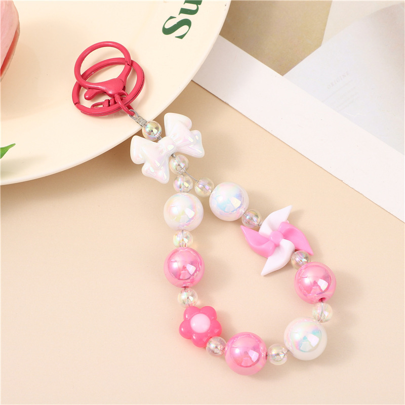 Japón y Corea del Sur color ins hecho a mano con cuentas flor llavero cordón de muñeca macaron color pétalo cordón de teléfono móvil en stock