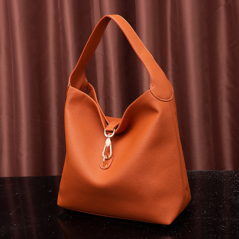 Neue handgehaltene Damen-Tasche mit körnigem Kieselmuster und einer Schulter unter dem Arm_voghion.com