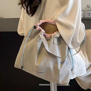 小众休闲帆布包包女2026新款大容量托特包百搭购物袋大学生上课包