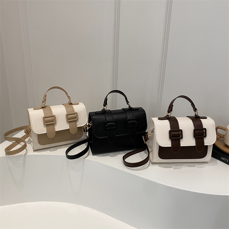 Bolsa de hombro de invierno de color extranjero para mujeres 2024 nueva moda mochila de tela de empalme elegante bolso de mano