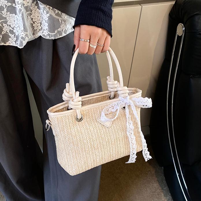 Bolsa de balde de mano de verano explosivo 2025, nueva bolsa de paja de vacaciones en la playa para viajar al trabajo, bolsa de hombro de alta calidad