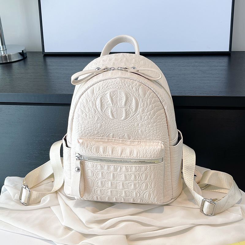 Simple color sólido de gran capacidad de estilo universitario mochila de damas 2025 nueva moda de comercio exterior mochila de viaje de viaje para mujeres