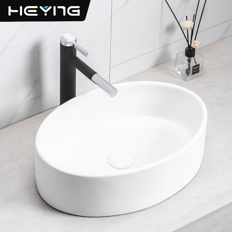 lavabo de cerámica simple elíptico en la mesa de arte lavabo pequeño tipo de lavabo fábrica de lavabo único al por mayor image 3