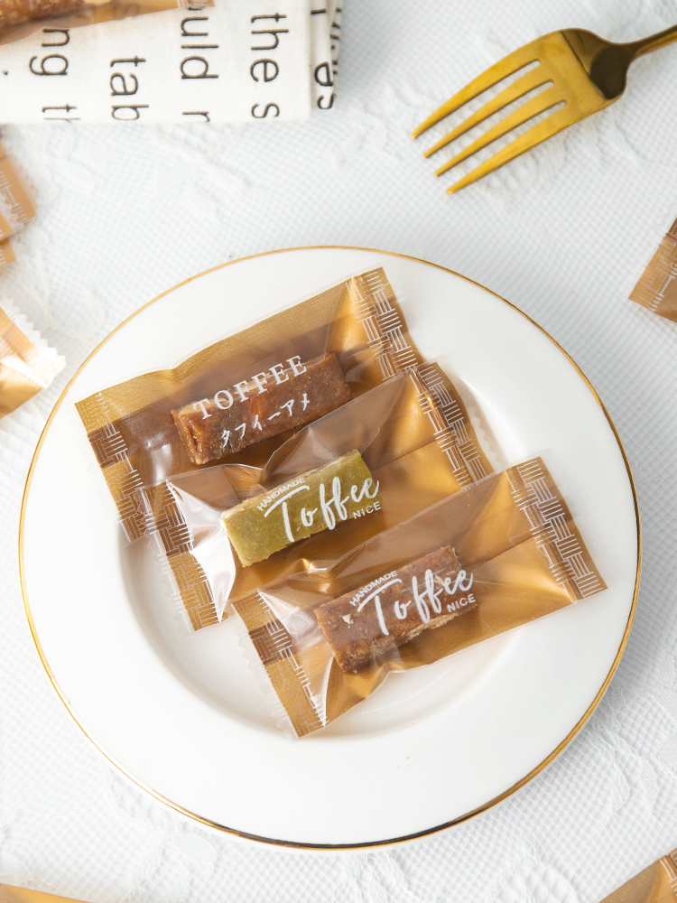 Bolsa de toffee de almendras de sal de mar gruesa independiente Tauragnut único caramelo de café sellado de máquina Año Nuevo 2025