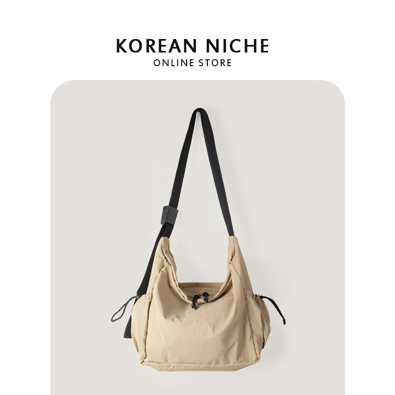 Nuevo estilo coreano versátil casual bolsa de asas de nylon para estudiantes mujeres nicho diseño ligero de gran capacidad hombro mensajero bolsa