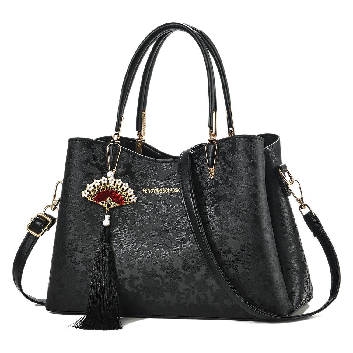 Bolso de mujer Regalo del día de la madre Bolso de madre estampado de moda caliente 2025 nuevo bolso de hombro de viajero de estilo nacional