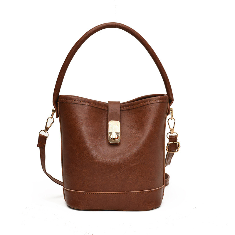 Niche Zhong retro coreano versátil bolso de cubo portátil de moda de mujer otoño y invierno viajero PU alta textura mochila