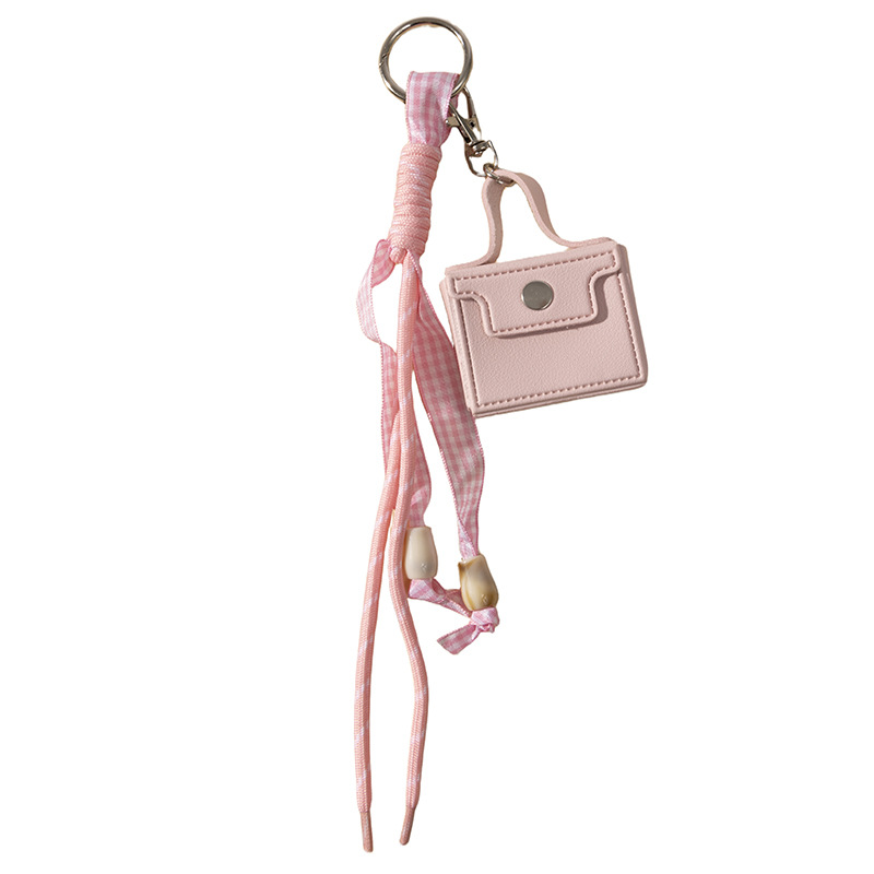 Nuevo bolso transfronterizo monedero llavero cuerda anudada colgante linda niña exquisito pequeño regalo al por mayor