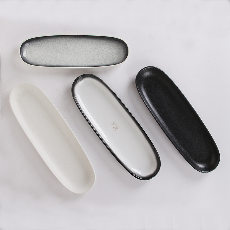 Plato de cerámica negro blanco ovalado rectangular de estilo japonés plato doméstico plato de sushi de restaurante japonés plato de ensalada plato frío