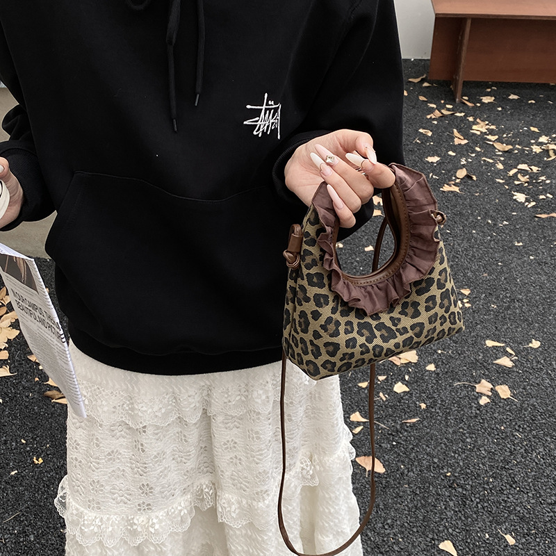 Moda coreana con patrón de leopardo para niñas bolsos de encaje exquisitos mini bolsos de hombro para bebés bolsos de comercio exterior transfronterizos para niños