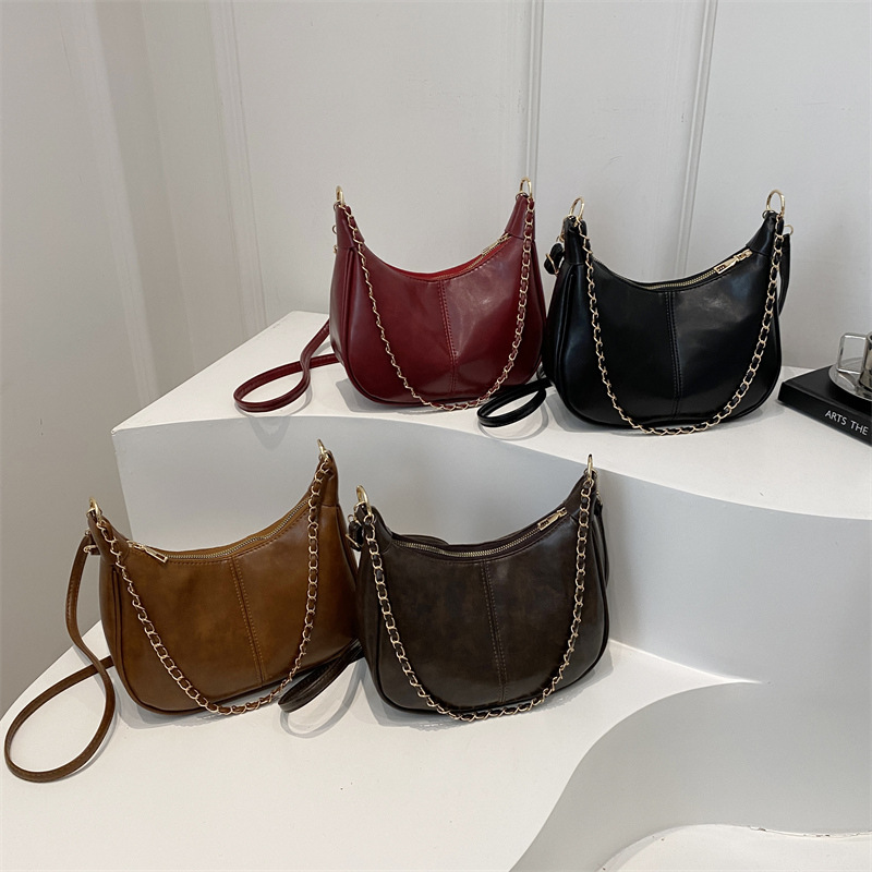 Bolsa de cadena de textura para mujeres de gran capacidad 2025, nuevo bolso de mujer simple PU, bolso de hombro de moda empalmado mochila