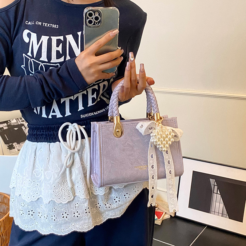 Bolso cuadrado pequeño portátil más vendido transfronterizo para mujer 2025 nuevo bolso de hombro de moda de nicho bolso de mensajero de alta gama