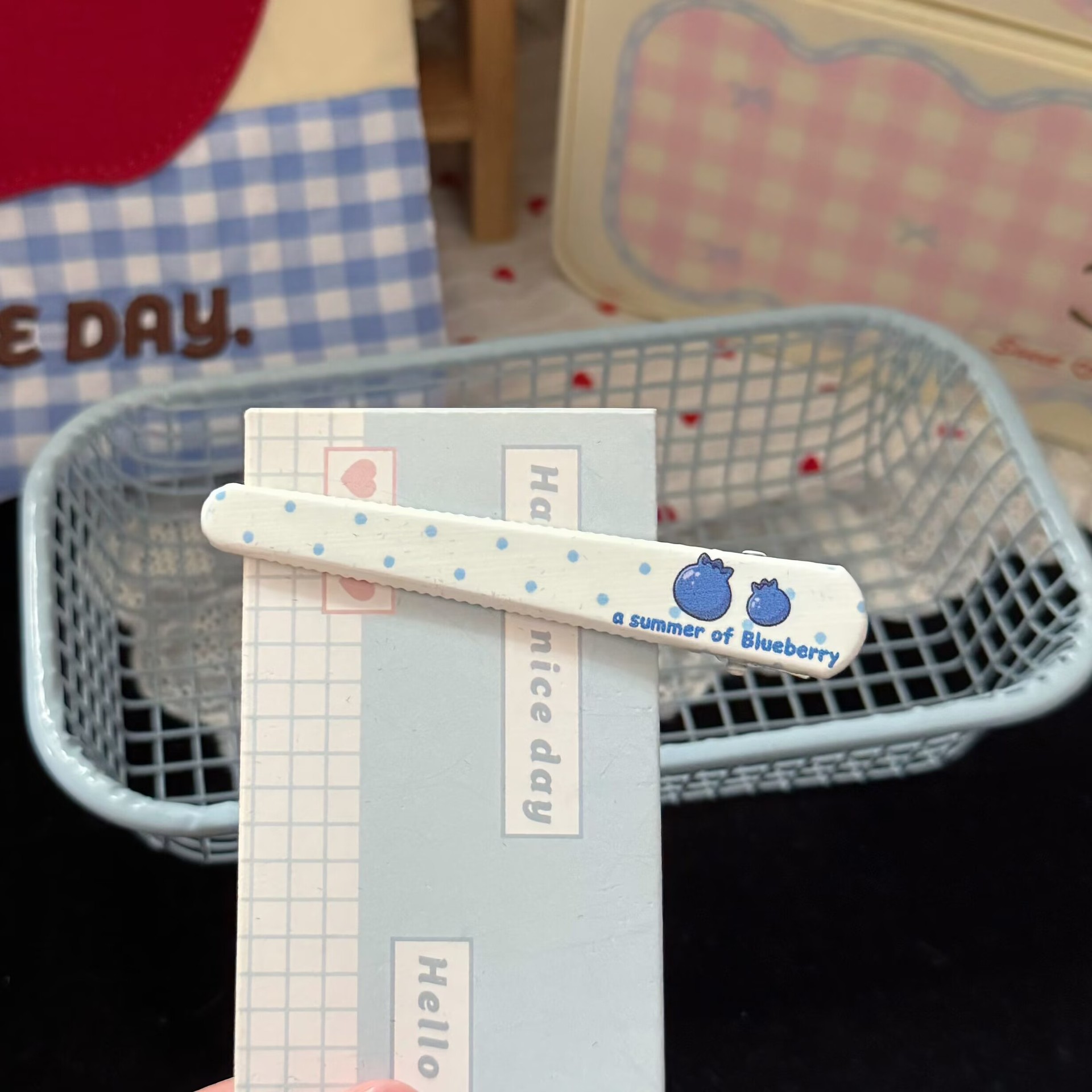 Two blueberry hair clips