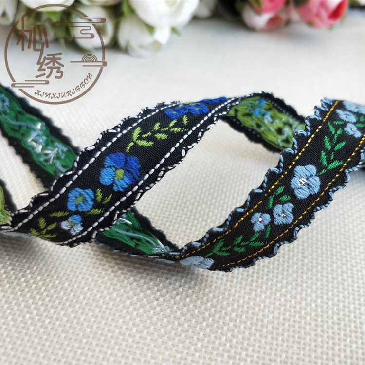 現物の美しい刺繍の小さい立体の田園風の舞台の服装は辺の双歯の辺の民族の風の綿の質のジャカードのリボンをはめ込みます。