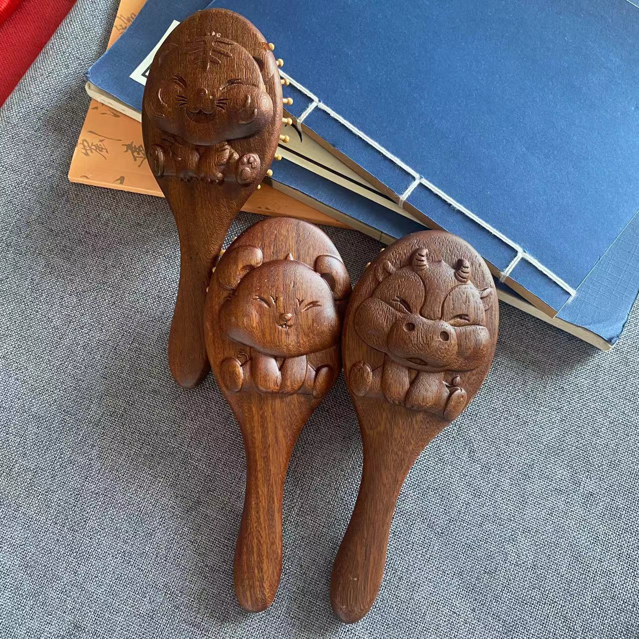 The 12 Zodiac Sandalwood Airbag Massage Comb comes in various styles, portable and adorable, making it a great gift item.