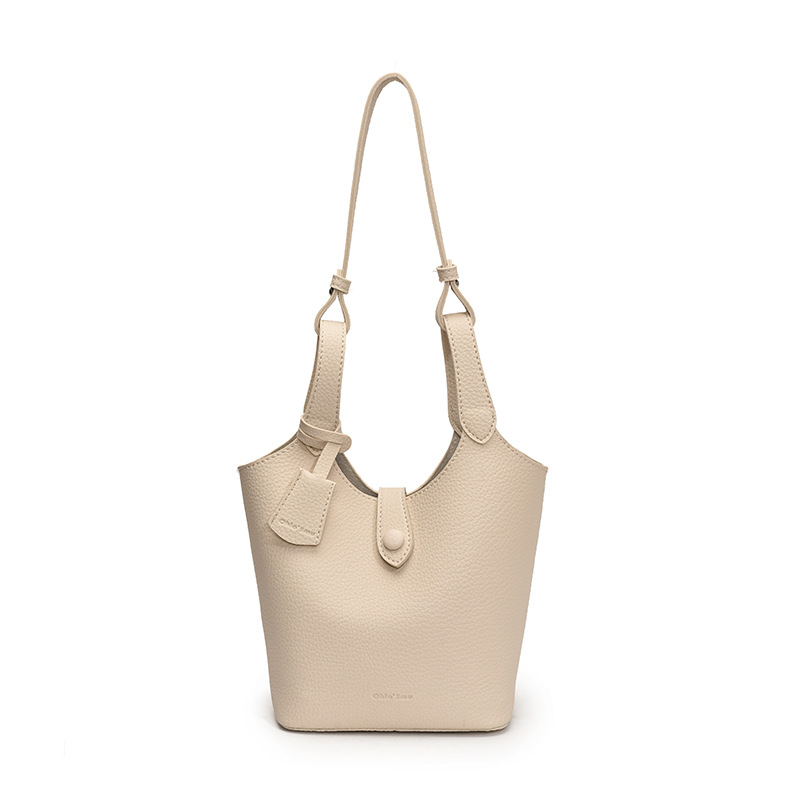 Moda coreana de gran capacidad bolsas de cubo de mano mujeres 2025 primavera y verano nueva canasta de lichi mochila de hombro