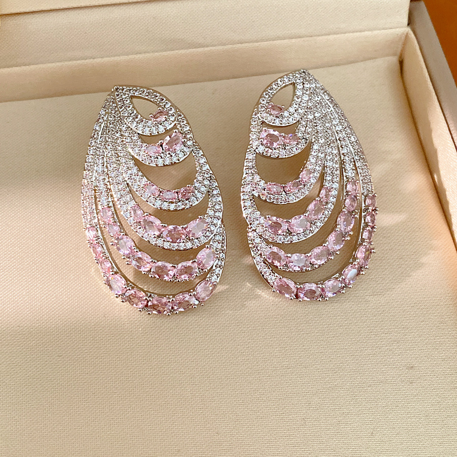 Aguja de plata zircon oval multicapa personalidad temperamento nicho pendientes de moda ligero lujo alta sensación auriculares al por mayor