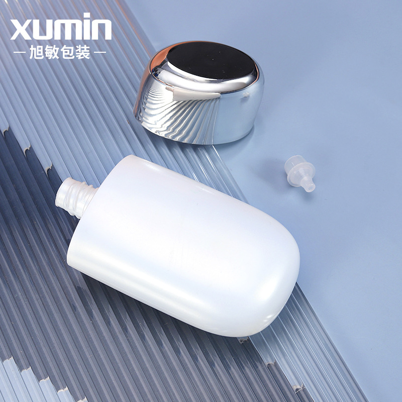Nuevo Xumin embalaje cosméticos maquillaje frente leche manguera 50ml blanco protector solar crema botella brillante plata cubierta aislamiento crema botella