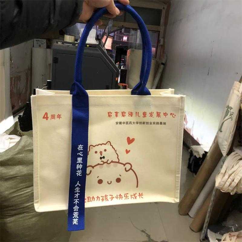 帆布袋定 制手提飘带立体托特包美术舞蹈班展会宣传立体包定 做新