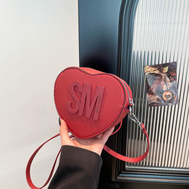 Bolsos para mujer 2025 Día de San Valentín Nuevo estilo Moda europea y americana Letras populares Color sólido Bolso en forma de corazón bags Bolso de hombro de moda