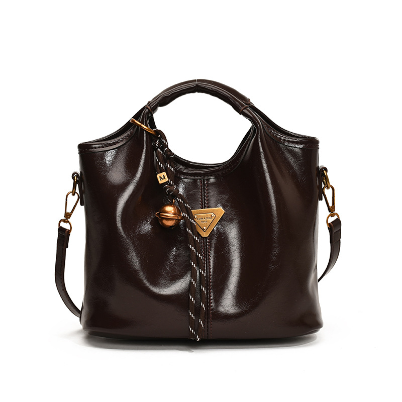 Moda portátil de cera de cuero bolso de agua para mujeres 2024 nueva moda coreana bolso de hombro de alta calidad bolso de mujer versátil