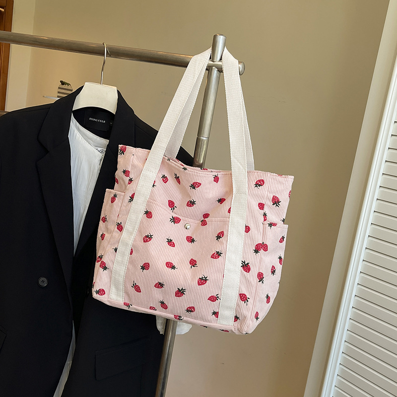 2025 verano nuevo bolso de mano de gran capacidad simple estilo universitario de moda ocio de tela de meandarra bolso de hombro