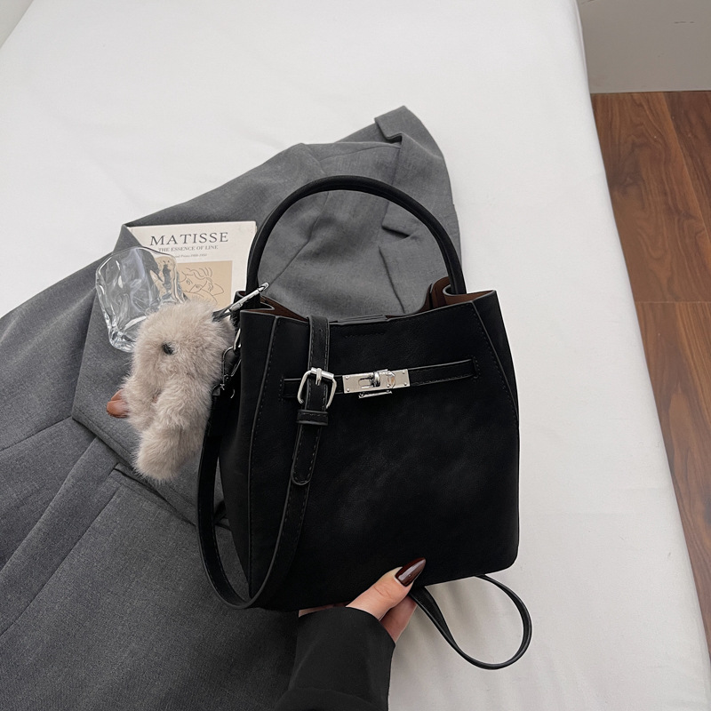 Transfronterizos otoño invierno hija bolsa retro versátil bolso de cubo portátil 2025 nuevo estilo de alta calidad sensación de hombro mochila moda