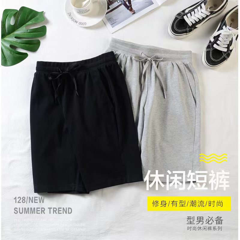Pantalones cortos masculinos de Nueva tendencia, pantalones cortos casuales de moda, pantalones de algodón de cintura media, pantalones de cintura media de color sólido, impresión al por mayor de la fábrica de pantalones juveniles micro - bomba