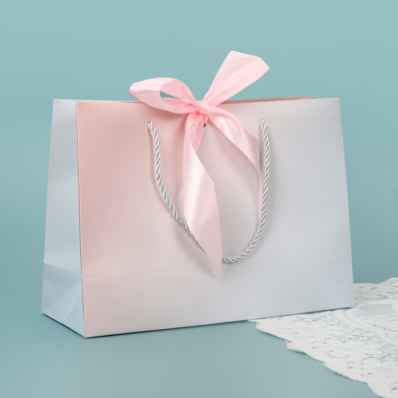 Bolso de papel arco bolsa de impresión ropa bolsa de regalo bolsa de compras bolsa de embalaje bolsa de cosméticos